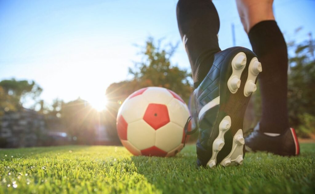 Woman And A Soccer Ball On The Grass Scaled.jpg